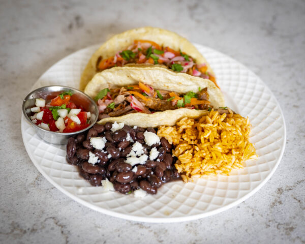 Carnitas Tacos<p class="archive-product-description" ><p>Pork carnitas topped with a kohlrabi slaw.  Served with rice and beans on the side.</p>
</p>
